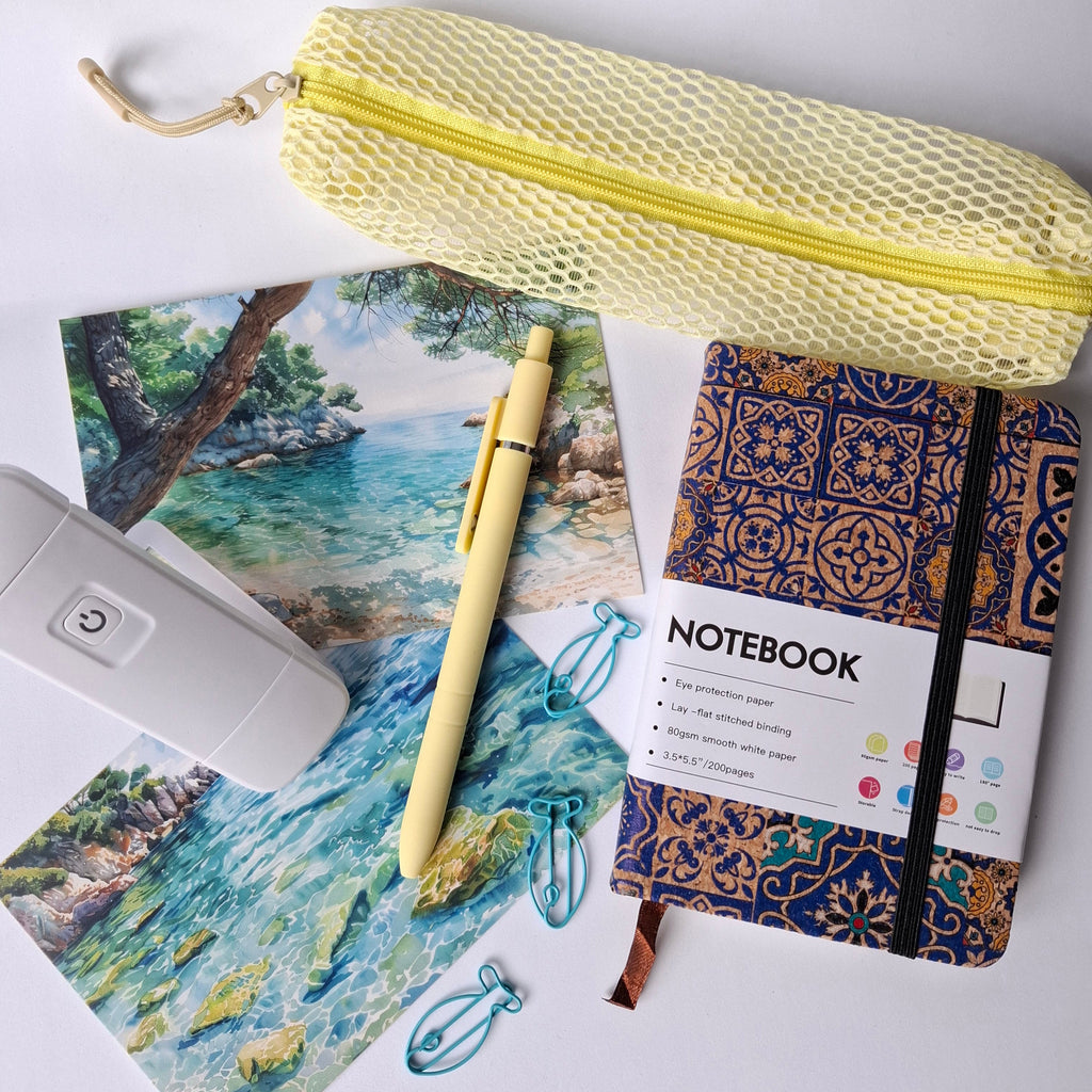 Notebook, pen, and pouch on a scenic background. Stationary subscription bundle